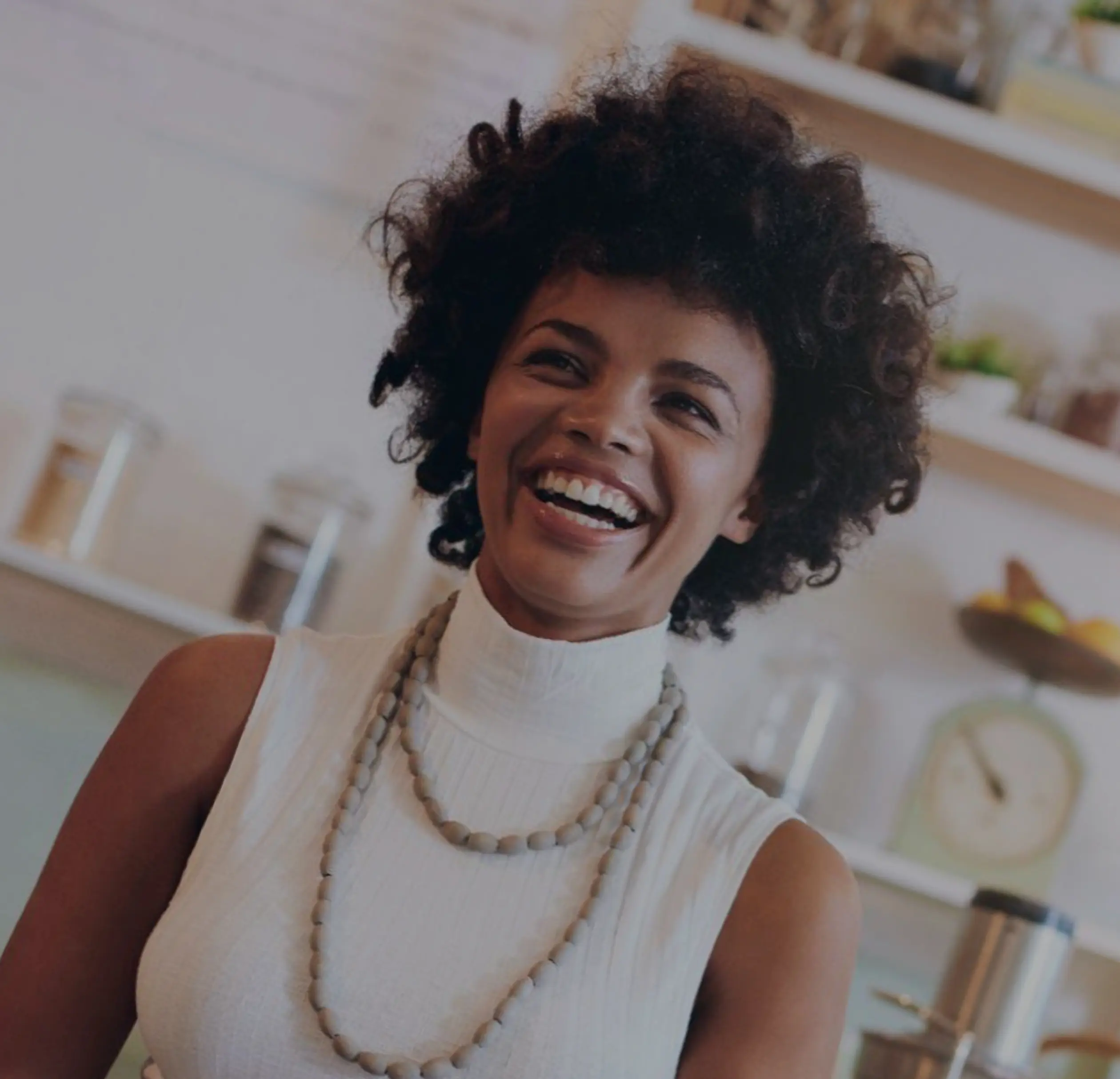 A woman smiling in her shop