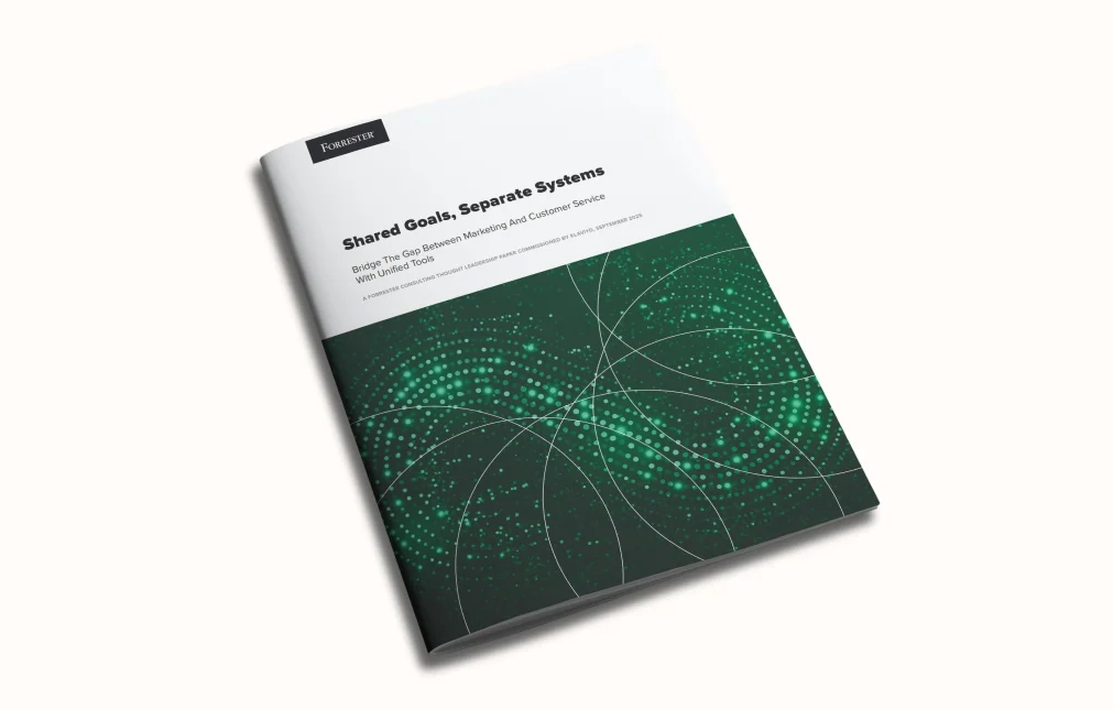 Forrester report titled "Shared Goals, Separate Systems" with a green abstract cover design.