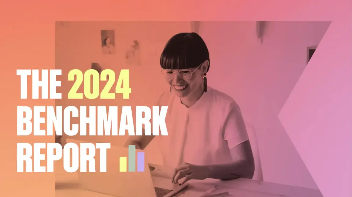 Woman smiling at a laptop, with text "The 2024 Benchmark Report" overlaid.