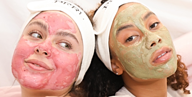 Two women wearing Perl Cosmetics' clay face masks