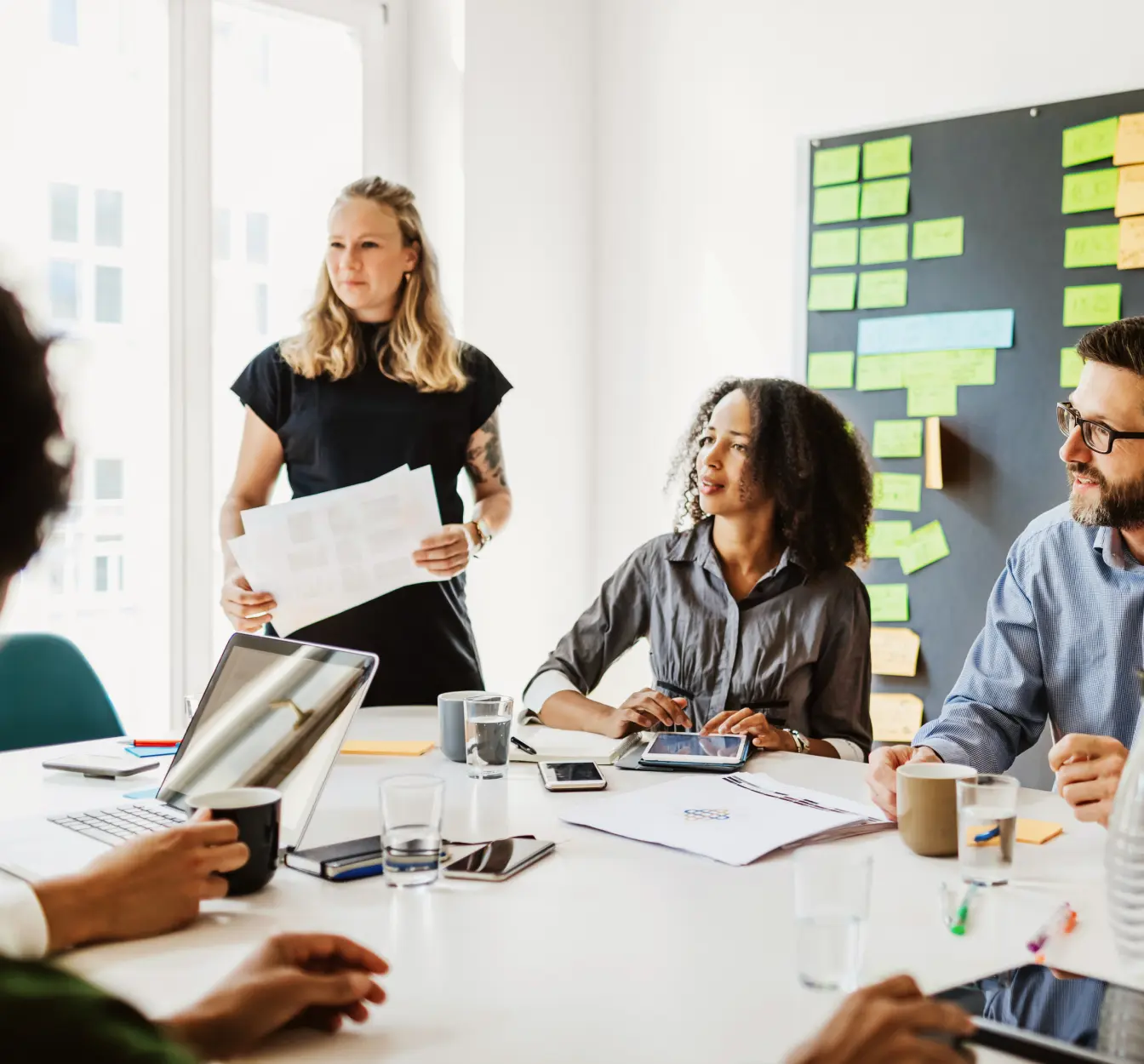 People working in an office around a table