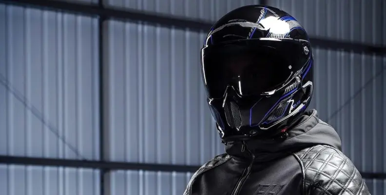 Motorcyclist wearing a black Ruroc crash helmet