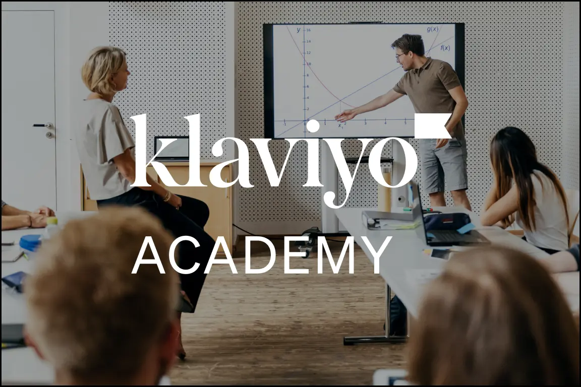 Image of man pointing in front of presentation screen with multiple people looking at him and screen; text over image reads Klaviyo academy