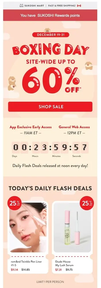 Image shows a Boxing Day marketing email from K-beauty lifestyle brand Sukoshi Mart, which uses bold red font on a peach-coloured background to advertise a 60% Boxing Day sale. Beneath the “shop sale” CTA button is a section detailing when access begins for those in the “app exclusive” group vs. general access, with a countdown clock to the sale’s end.