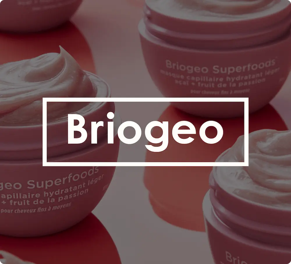 Briogeo Superfoods hair mask containers with cream, featuring the Briogeo logo overlay.