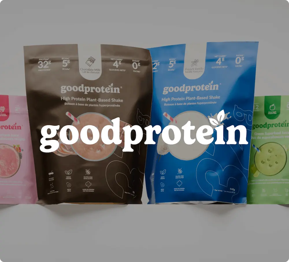 Various GoodProtein product packages, including plant-based shakes in chocolate and vanilla flavors, with the brand name prominently displayed.