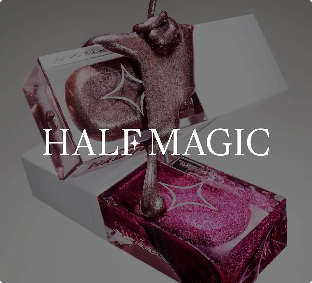 Two makeup products with shimmering liquid, labeled "HALF MAGIC.