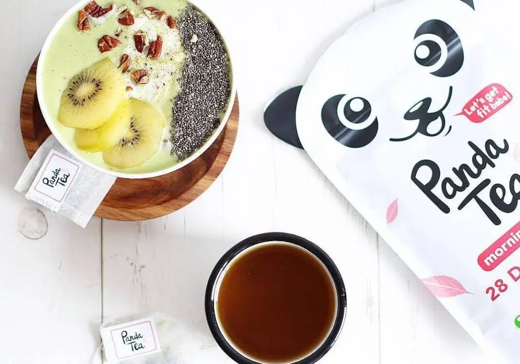 Two mugs side by side filled with Panda Tea, next to a package of Panda Tea.