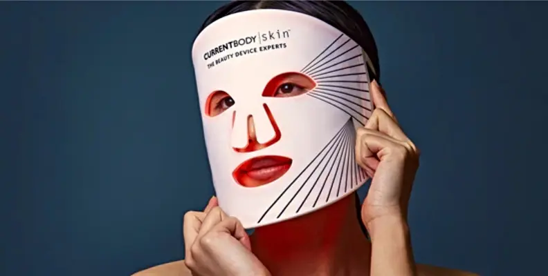 Woman wearing a face LED light mask