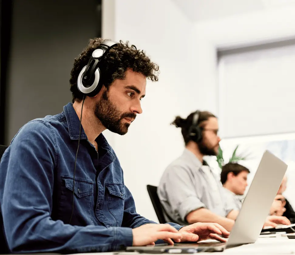 People wearing headsets in office