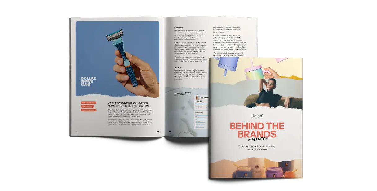 Open book with a page featuring Dollar Shave Club and a person holding a razor. Cover titled "Behind the Brands 2026 Edition.